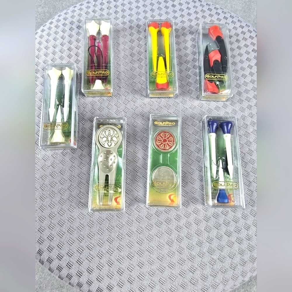Assortment of golf pro t's ball markers in different sizes...assortment of 7 pac